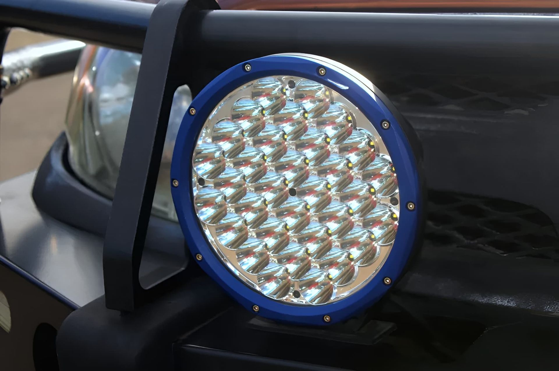 Blue-rimmed Led Spotlight Mounted on a Black Vehicle Bumper — GZM 4x4 Performance In Ballina, NSW