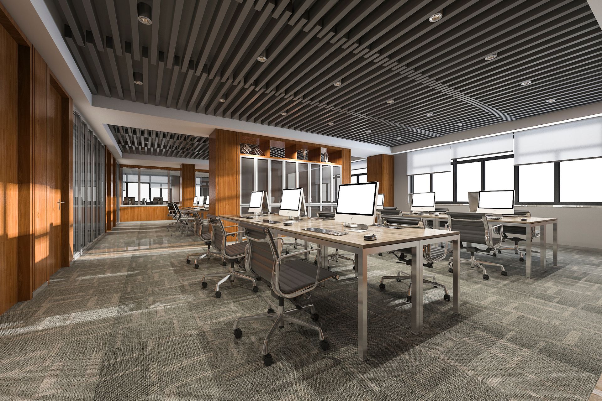 Modern open office with desks, computers, and large windows. Modern open office with desks, computers, and large windows.