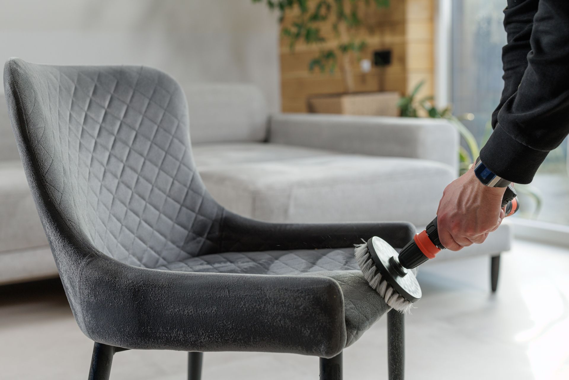 Brushing upholstered chair fabric for deep cleaning and stain removal process. Brushing upholstered chair fabric for deep cleaning and stain removal process.