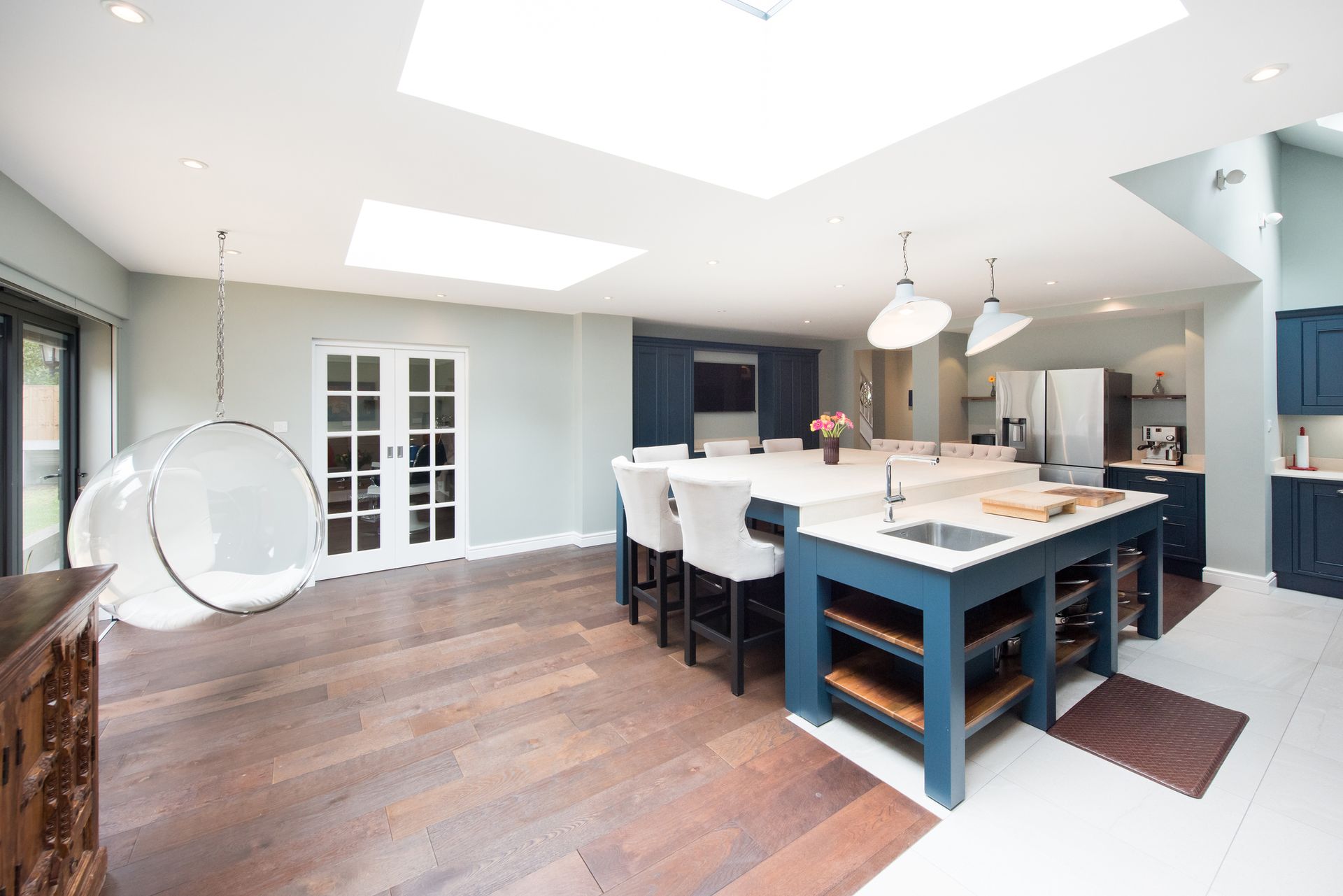 An empty house with hardwood floors and a ceiling fan - Wivenhoe, TAS - Summers Floors Pty Ltd
