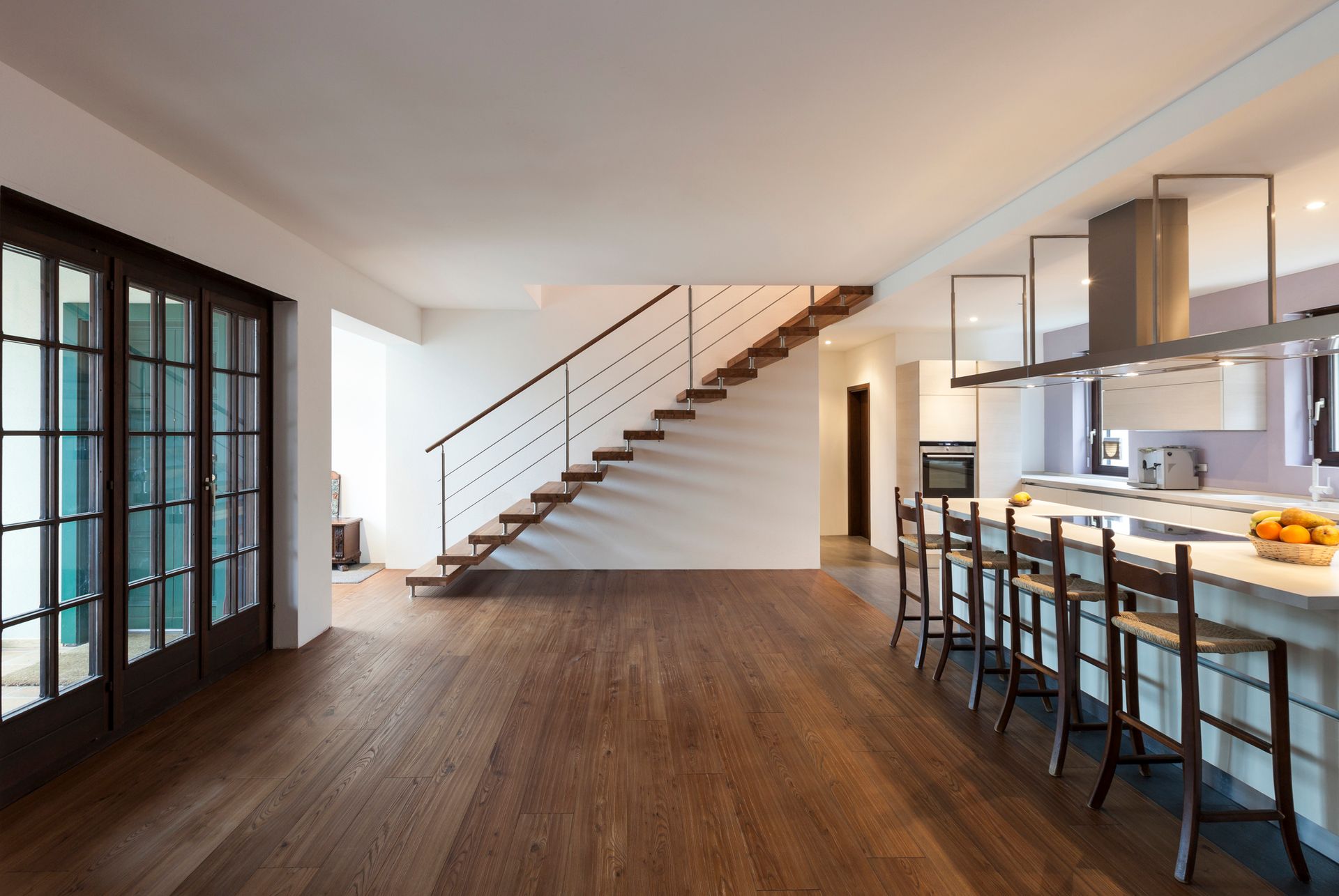 A kitchen with a staircase leading up to the second floor - Wivenhoe, TAS - Summers Floors Pty Ltd