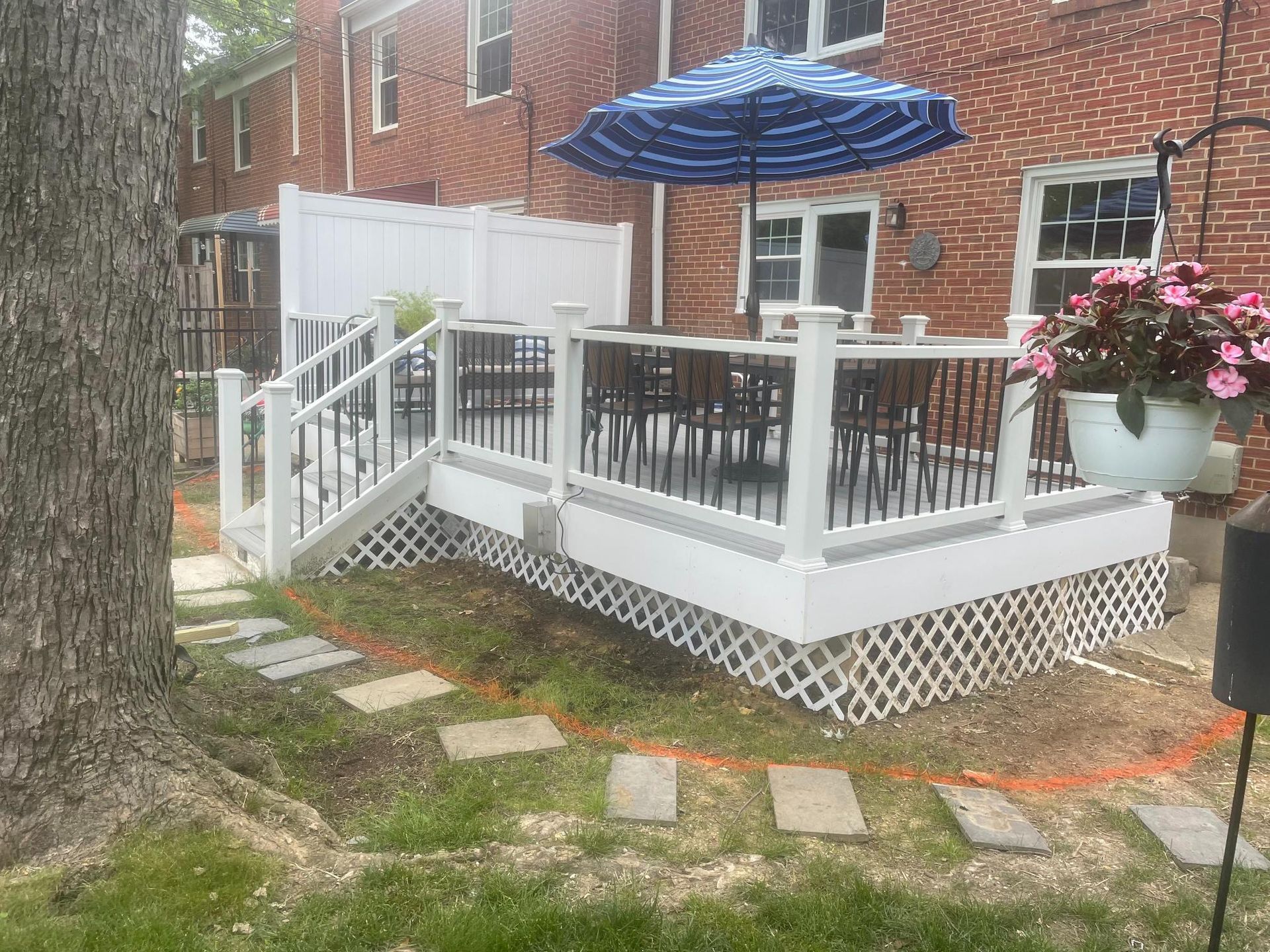 Custom white deck with railing and built-in bar seating