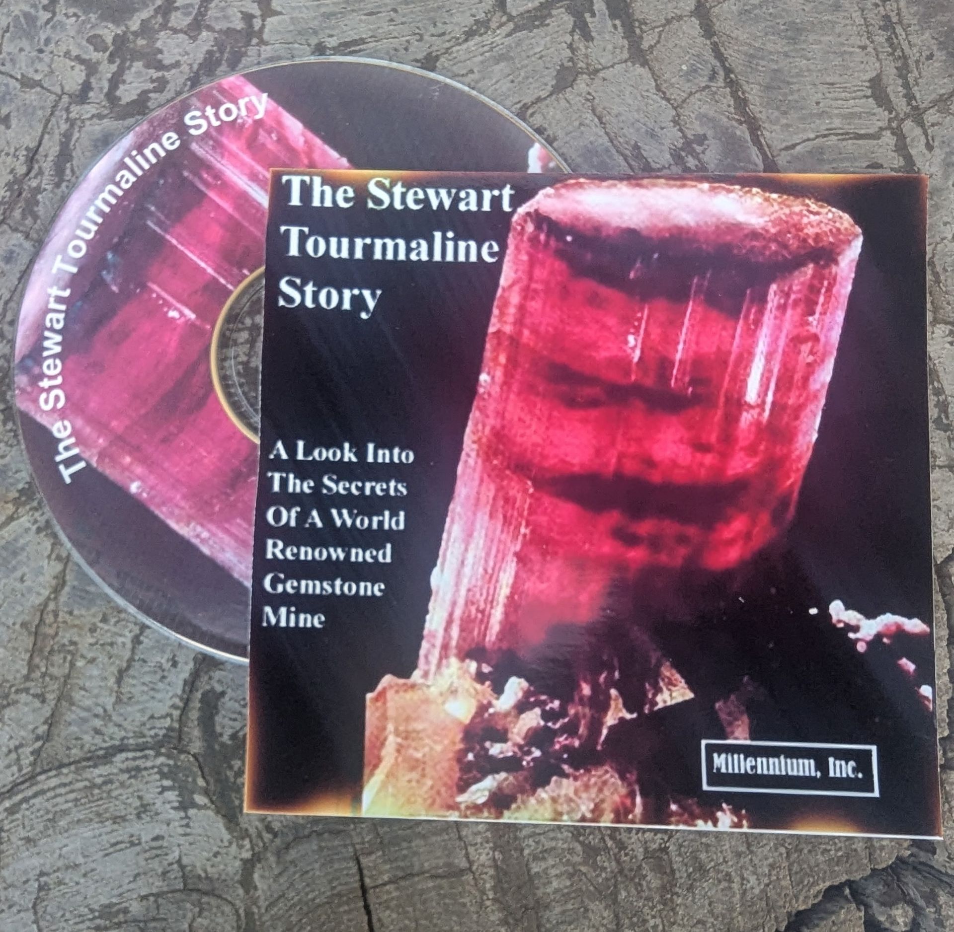 Booklet and DVD cover for “The Stewart Tourmaline Story,” showing a pink-red tourmaline crystal