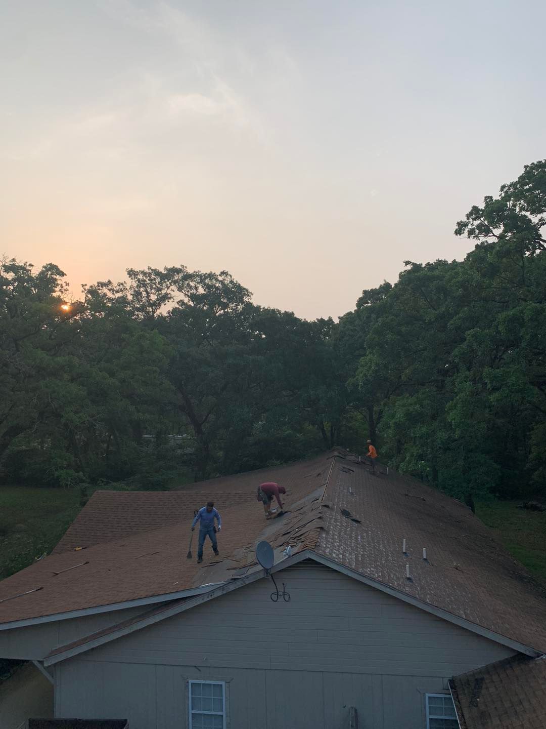 a roofing team working hard in eustace texas