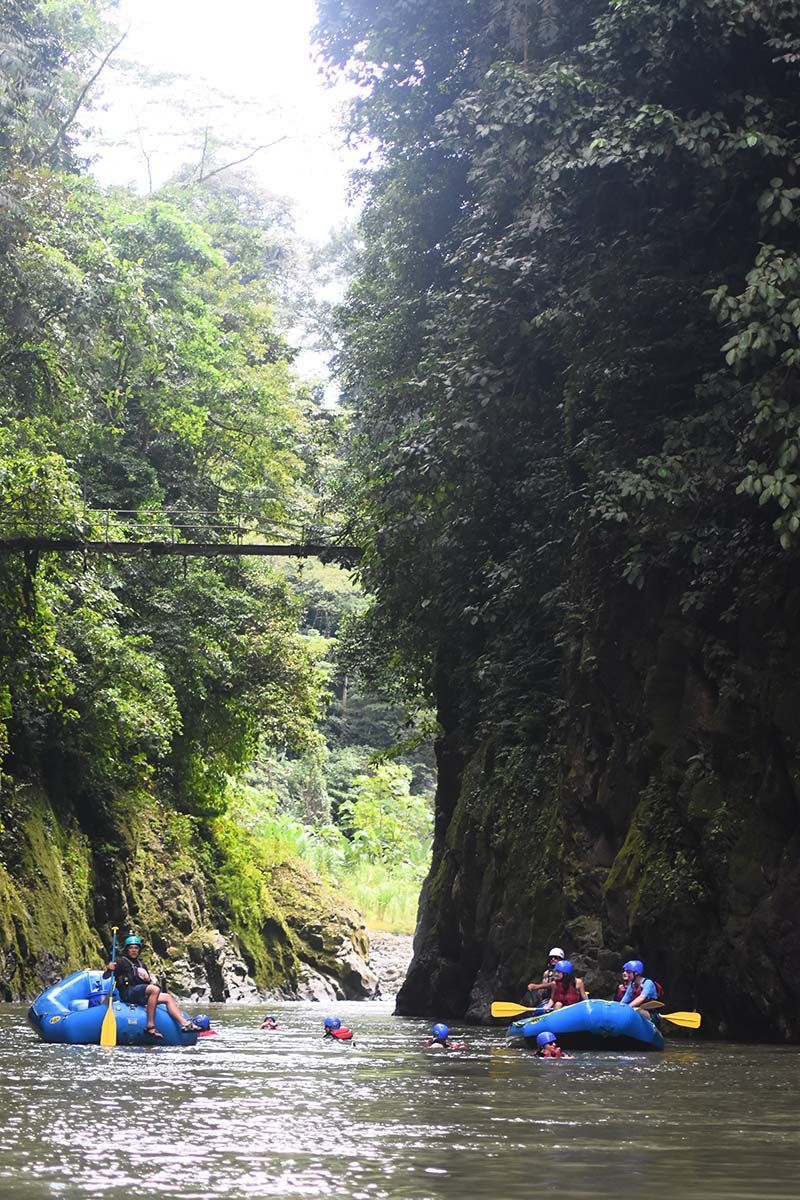 A group of people are rafting down a river.