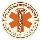 A logo for wilderness medicine with a snake on it