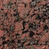 Et nærbillede af en pink granit bordplade.