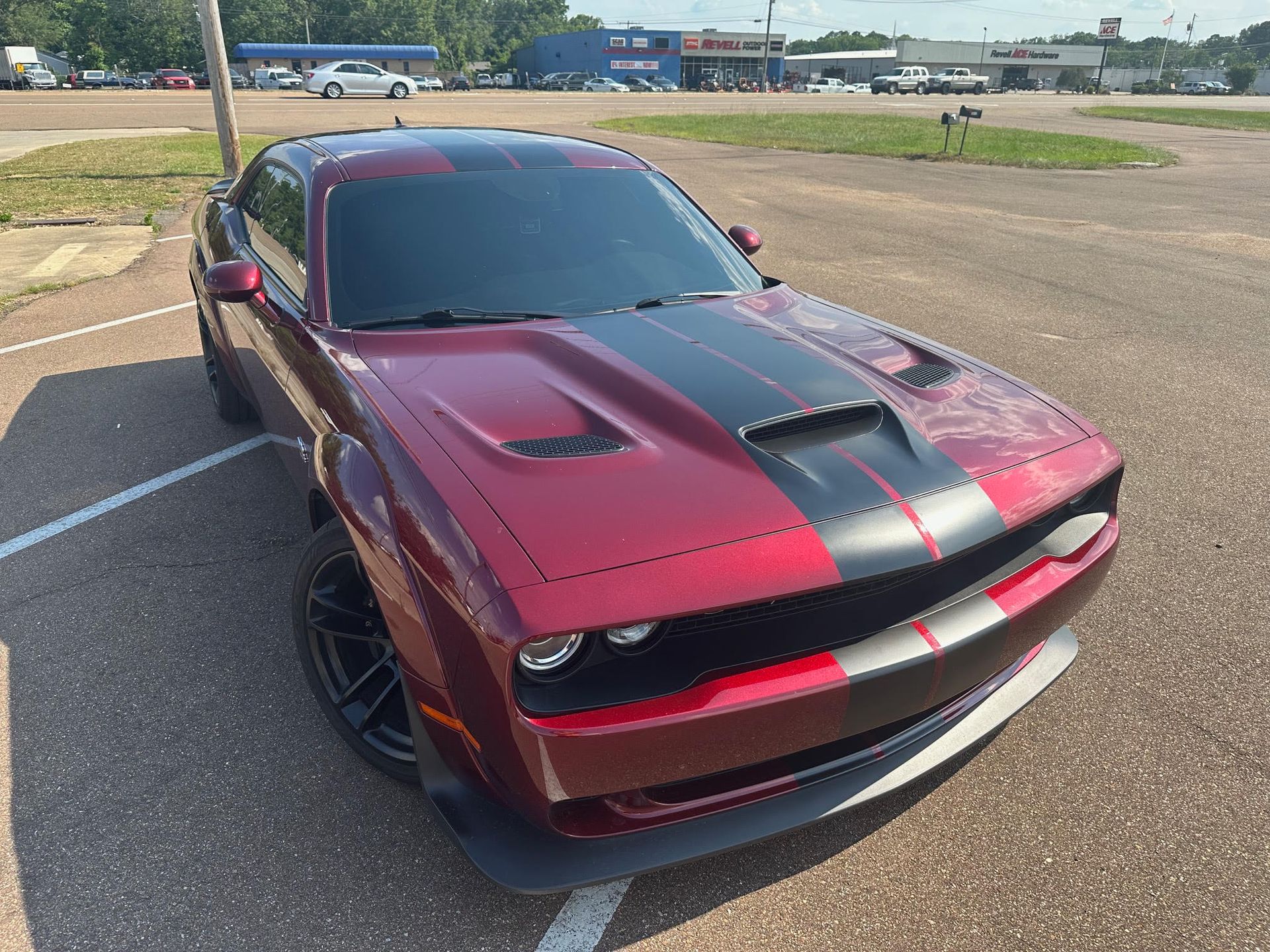 Dodge Challenger with a custom hood stripe graphic installed at Auto Trim Designs & Tint in Pearl, Mississippi.
