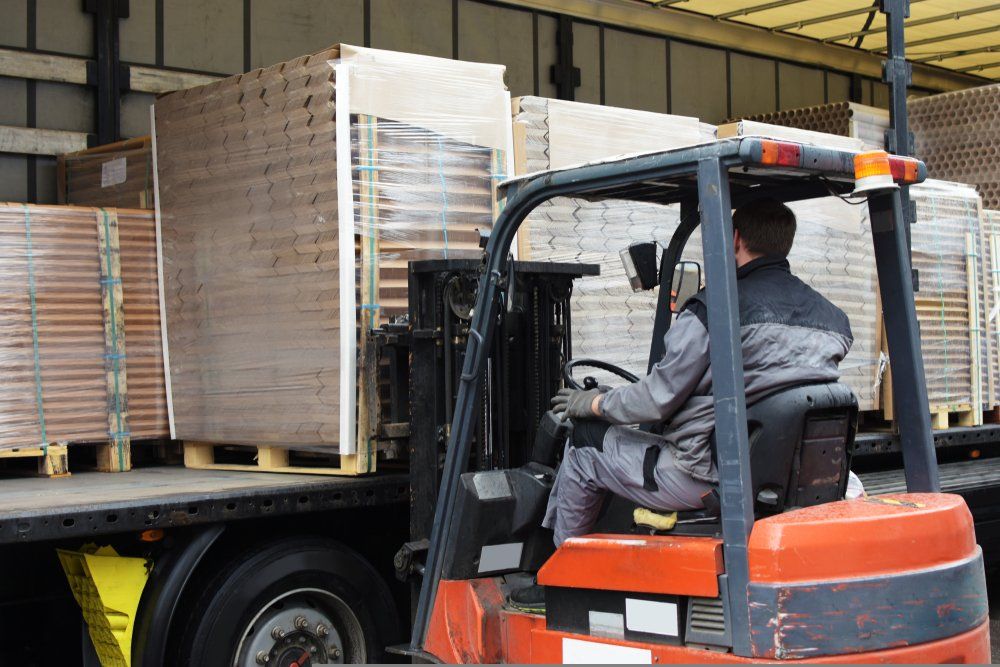team of workers use hand truck loading delivery van with cardboard boxes