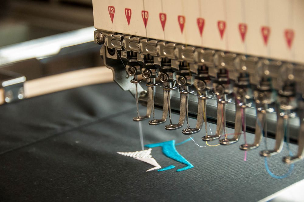 Sewing Machine With a Blue and White Embroidery on It — Embroidery Express in Nambour, QLD