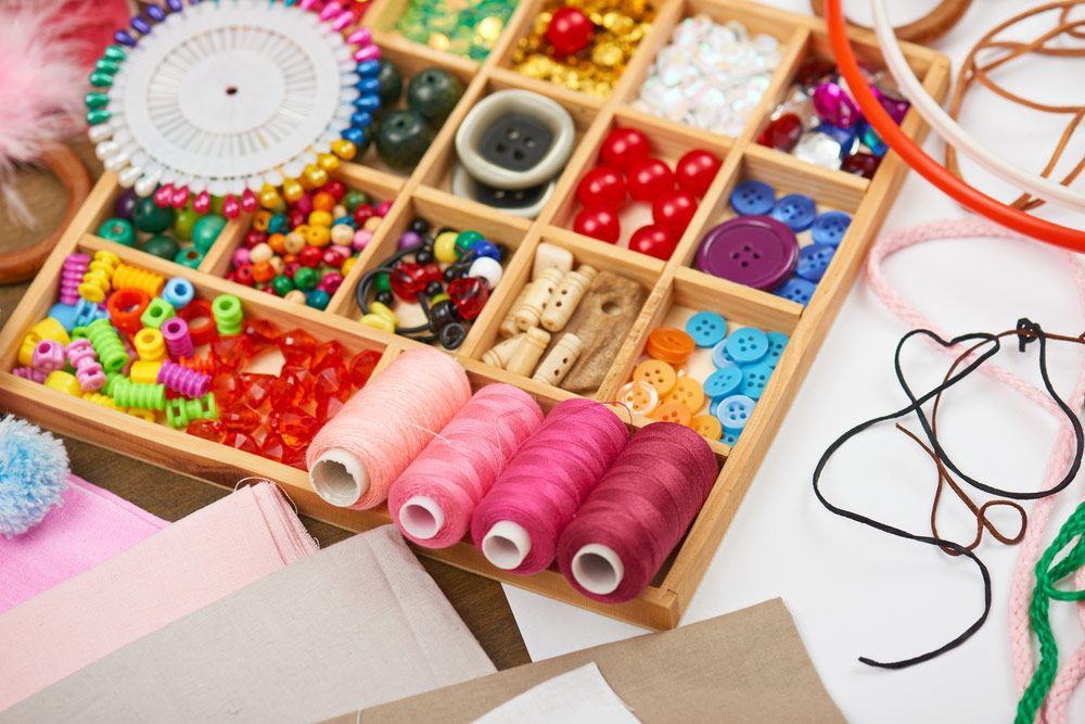 Wooden Box Filled With Spools of Thread and Other Sewing Supplies — Embroidery Express in Nambour, QLD