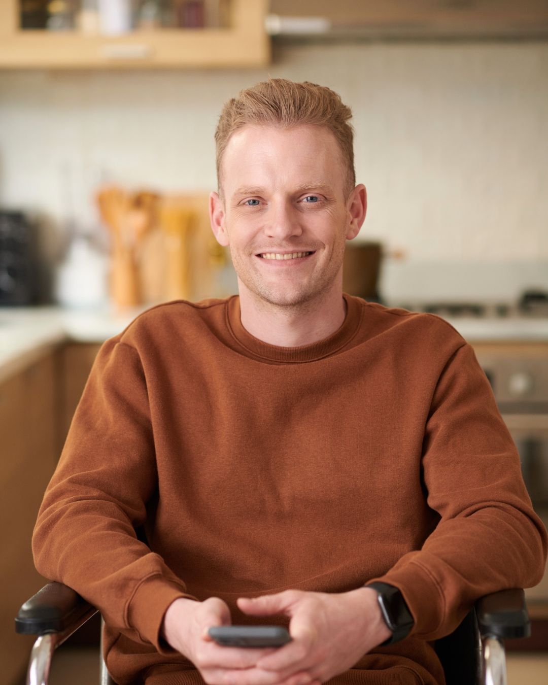 Smiling NDIS participant at home, representing the Plan and Grow NDIS Continuity Pathway for a seamless transition to a registered provider in Perth.