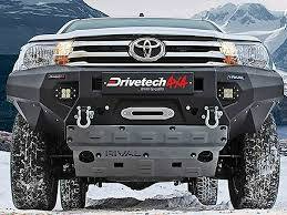 A Toyota Hilux Is Parked In The Snow — Town Automatics 4WD & Mechanical in South Townsville, QLD