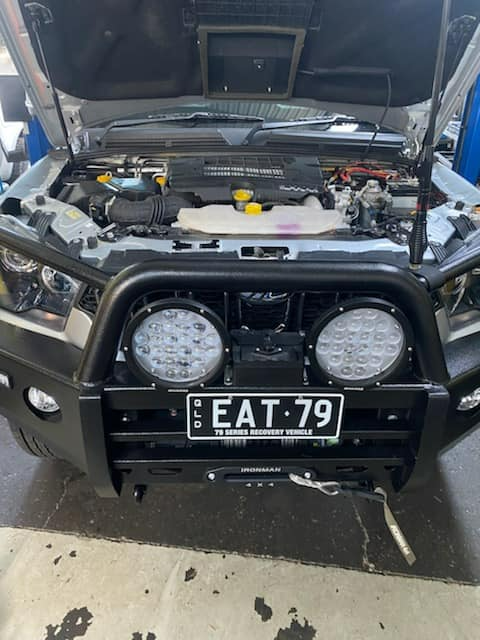 A Car With The Hood Open Has A License Plate That Says EAT 79 — Town Automatics 4WD & Mechanical in South Townsville, QLD