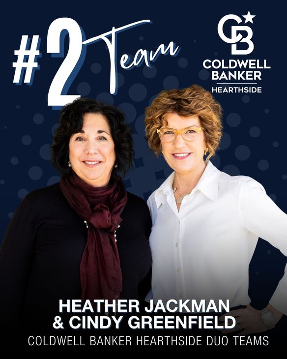 Heather Jackman & Cindy Greenfield, pose for a Coldwell Banker Hearthside , honored as a top 10 team.