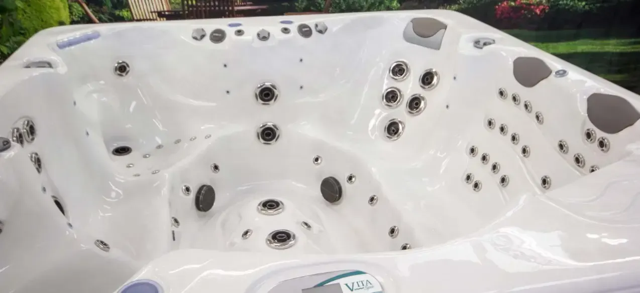 White hot tub interior with multiple jets and molded seats