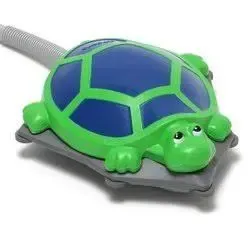 Green and blue turtle-shaped vacuum attachment on a gray hose
