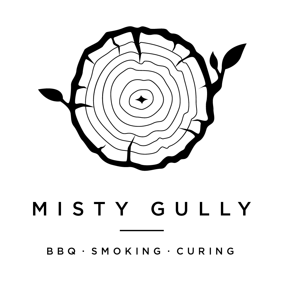 A black and white logo for Misty Gully, featuring a stylized tree trunk cross-section with the text below it.