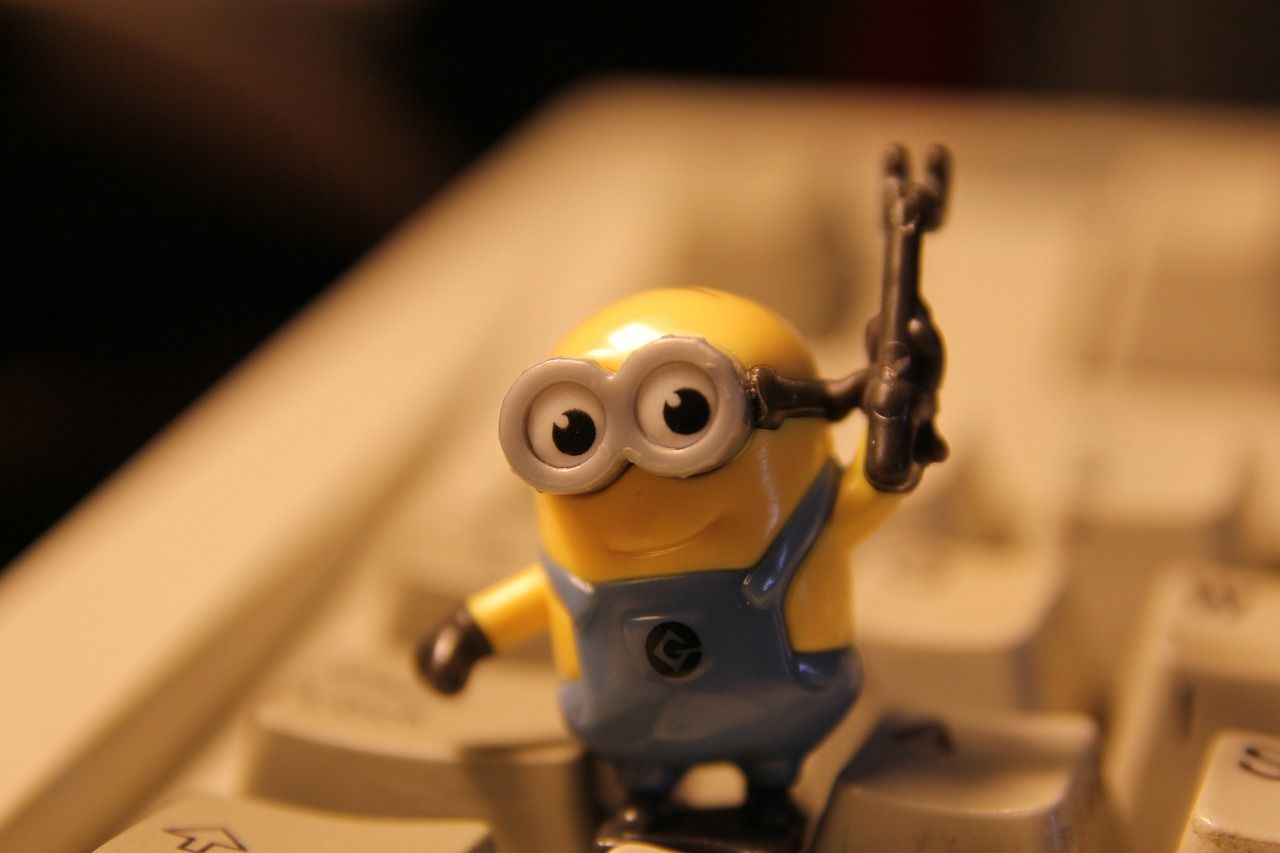 Minion Character Sitting on Keyboard