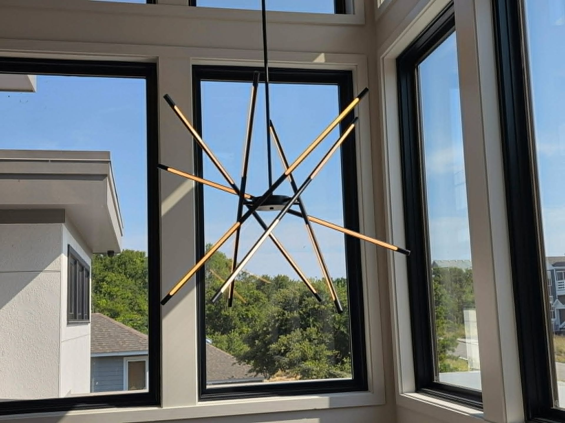 chandelier installation in a Southern Shores residential home by Shoreline Electric of KDH Outer Banks, NC