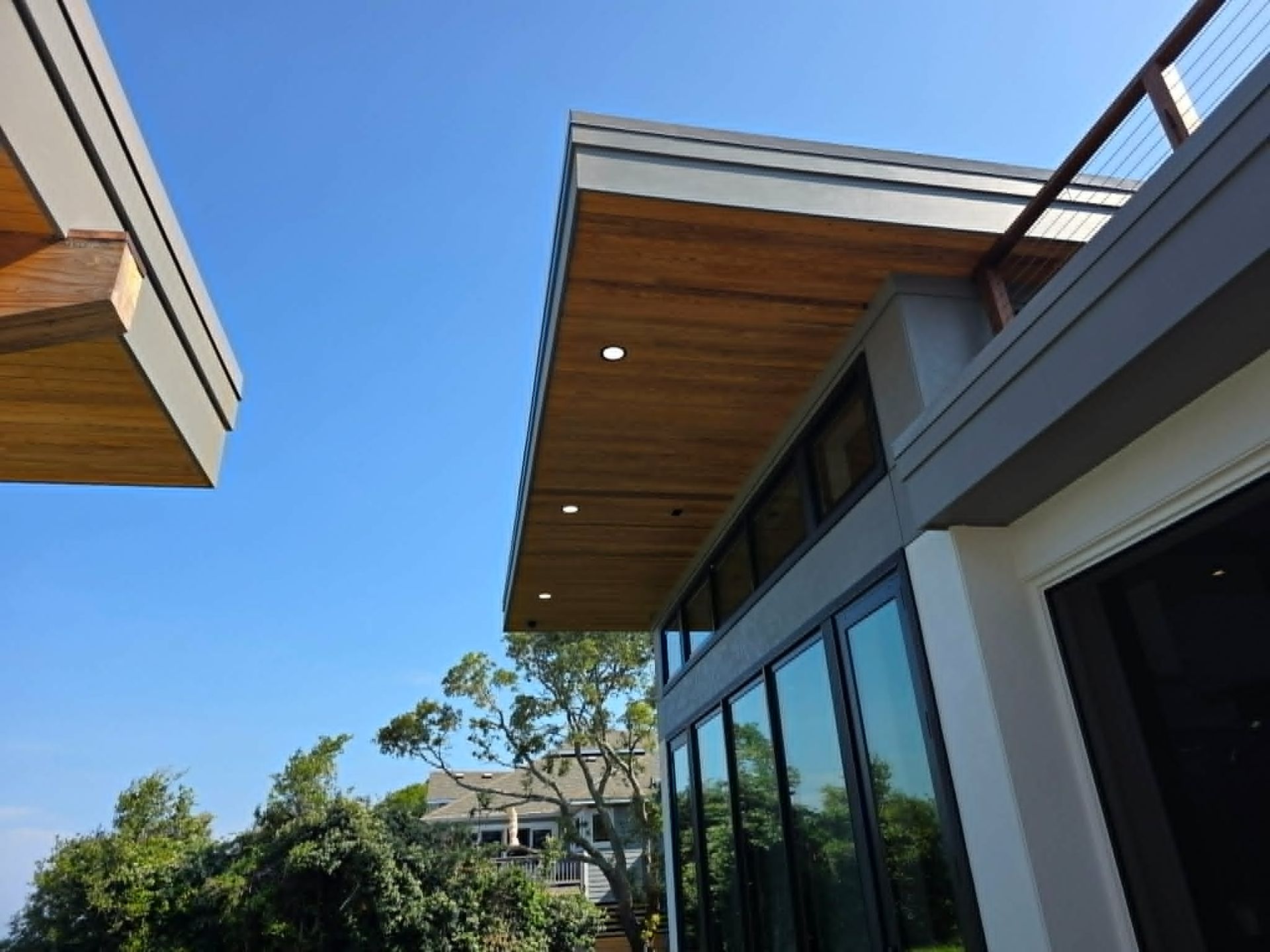 Modern exterior recessed lighting for an Outer Banks custom home by Shoreline Electric of KDH Outer Banks, NC