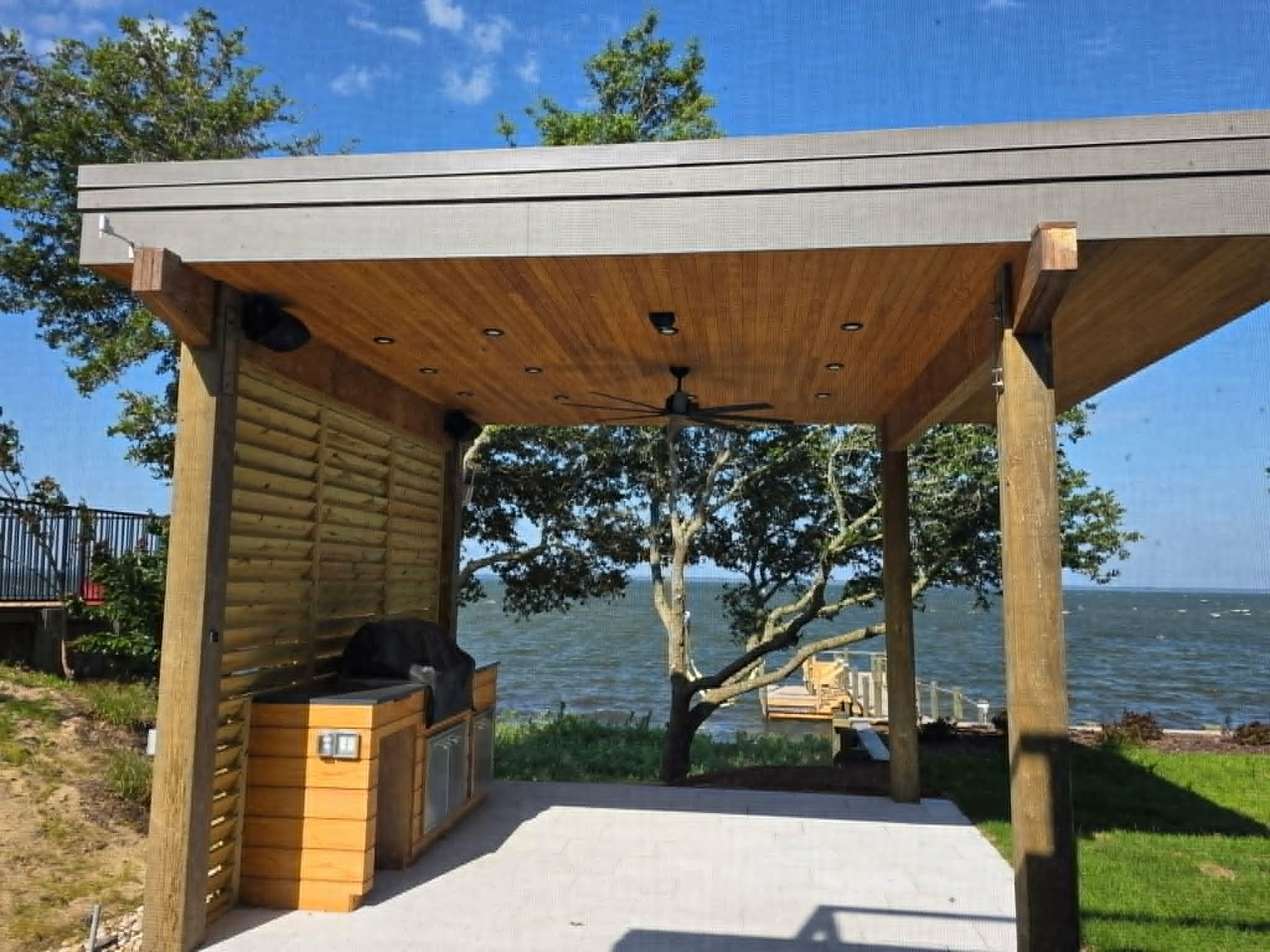 Covered outdoor kitchen electrical installation overlooking the water by Shoreline Electric of KDH Outer Banks, NC