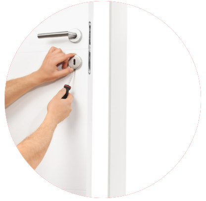 A person is fixing a door with a screwdriver
