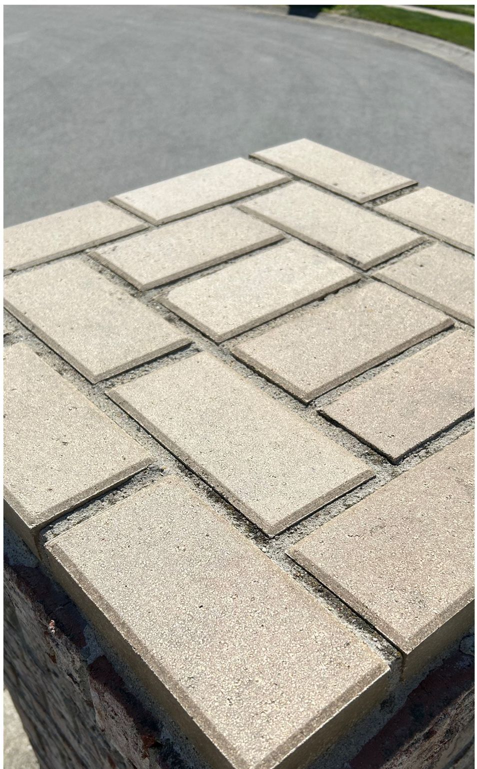 A pile of bricks sitting on top of a brick wall.