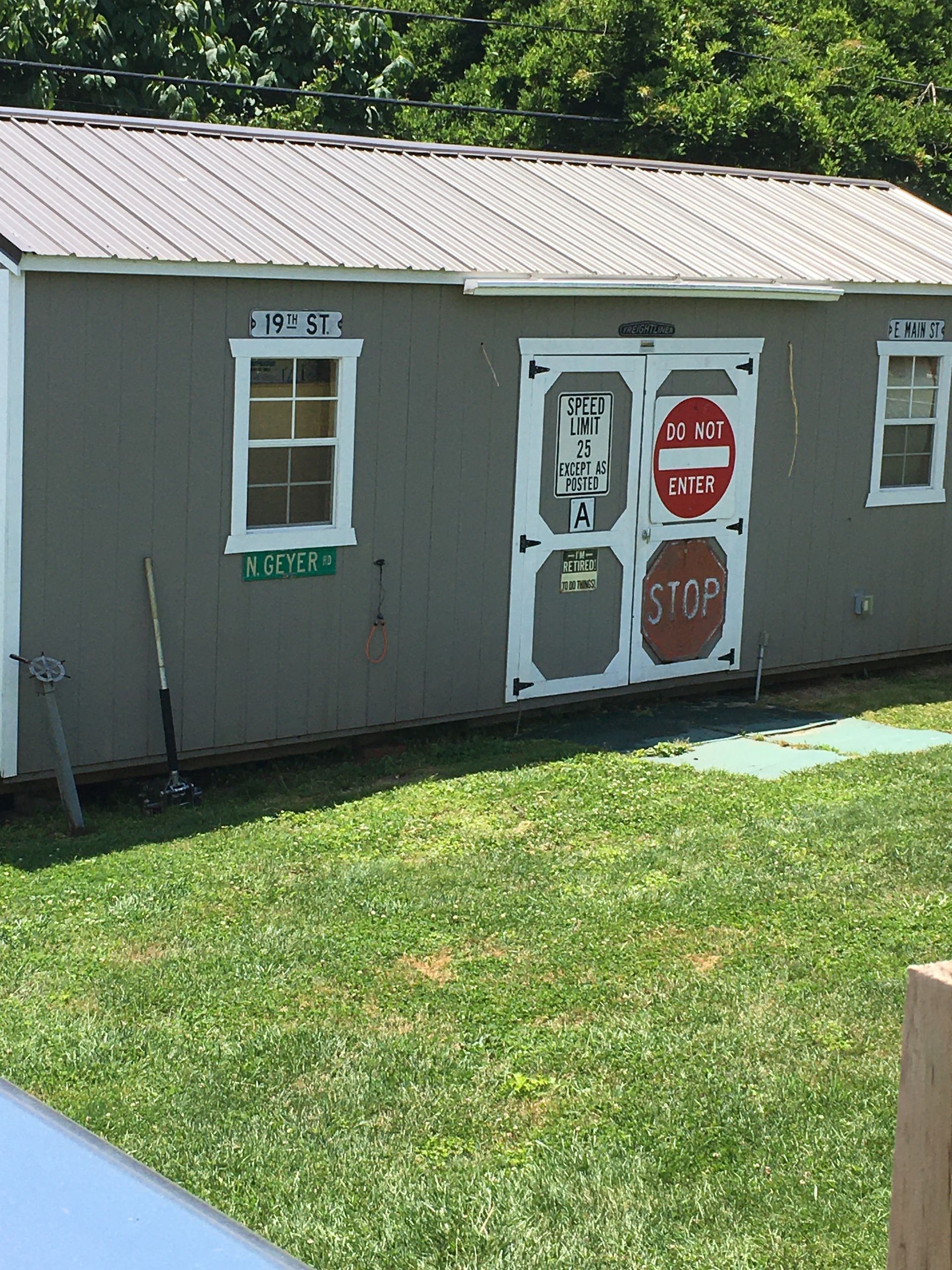 A shed with a stop sign painted on the door