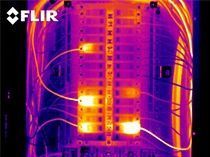 A thermal image of an electrical panel with a lot of wires coming out of it.