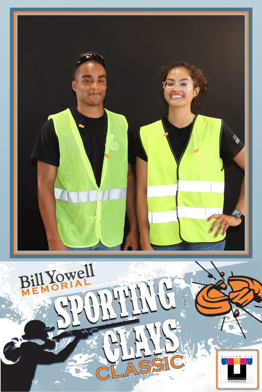 Animated GIF of two event team members posing in safety vests
