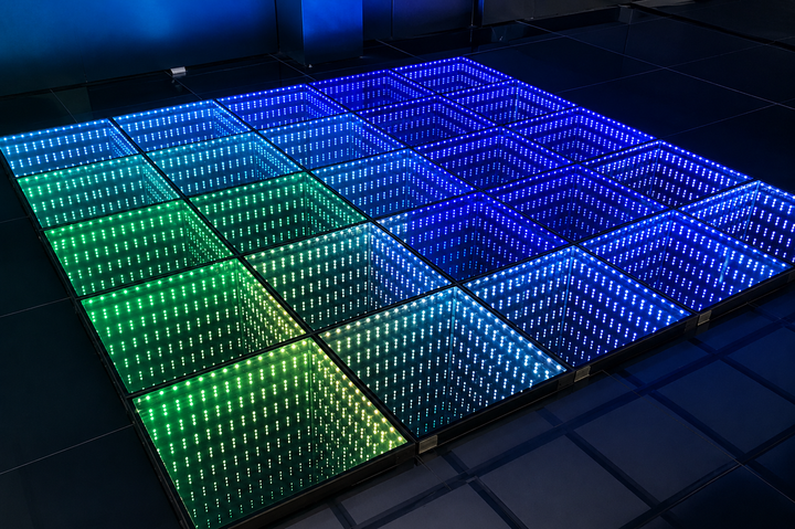 Colorful illuminated LED dance floor provided by Amethyst Star Ventures for a Central Texas event