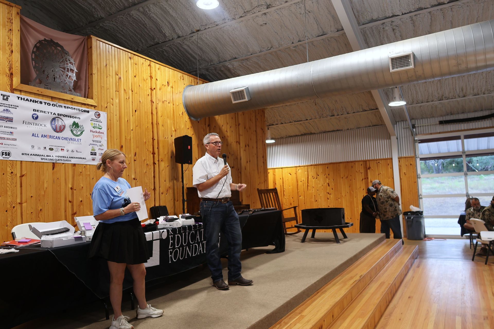 Guests gathering inside the sporting clays event venue