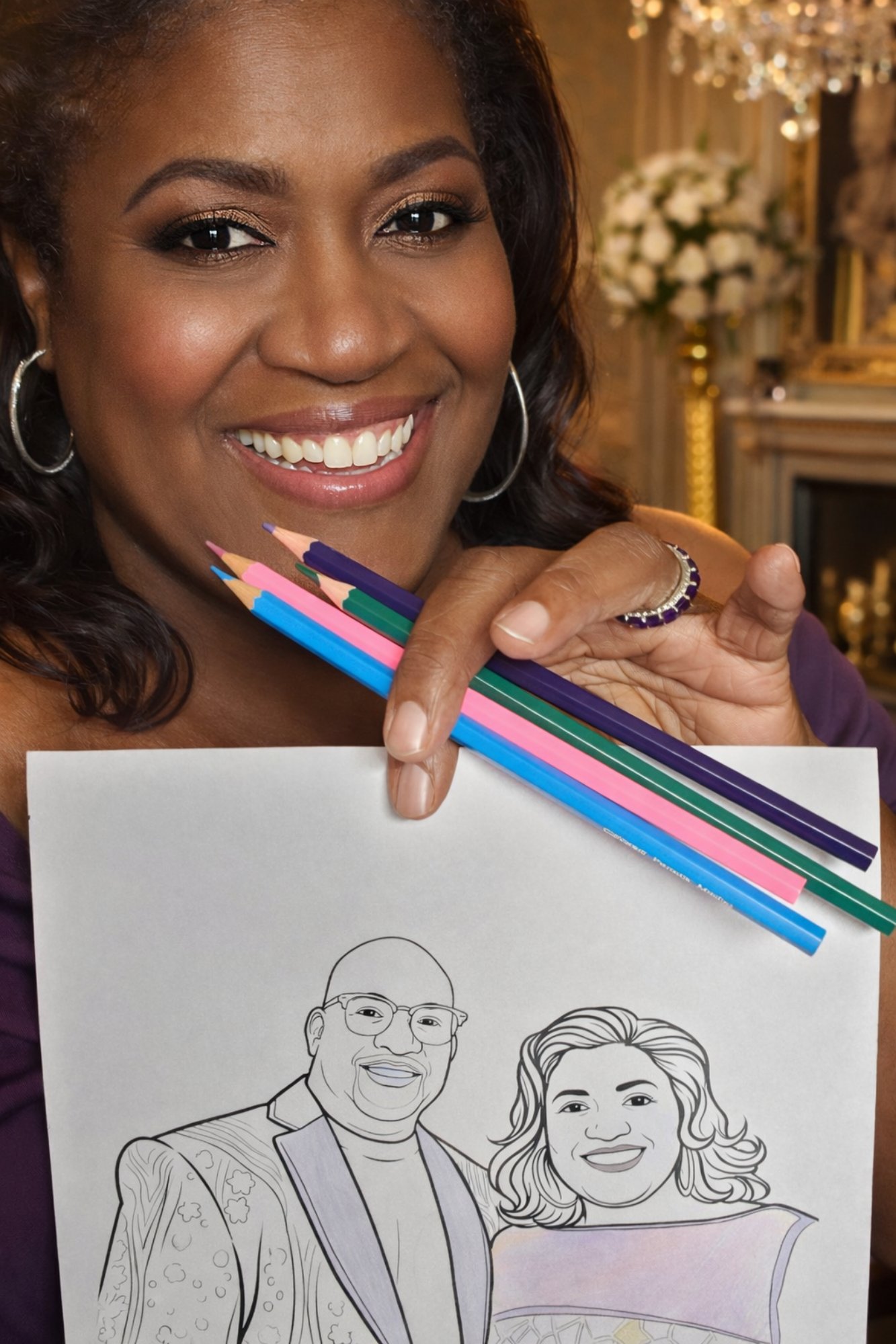 Guest holding colored pencils and a personalized coloring page