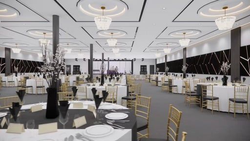 Elegant banquet hall with white tables, gold chairs, and black-and-white decor under chandeliers