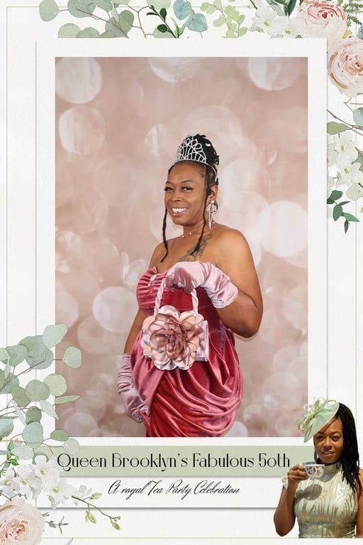 Woman in burgundy gown holding a bouquet, posing against a pink floral backdrop with a decorative frame.