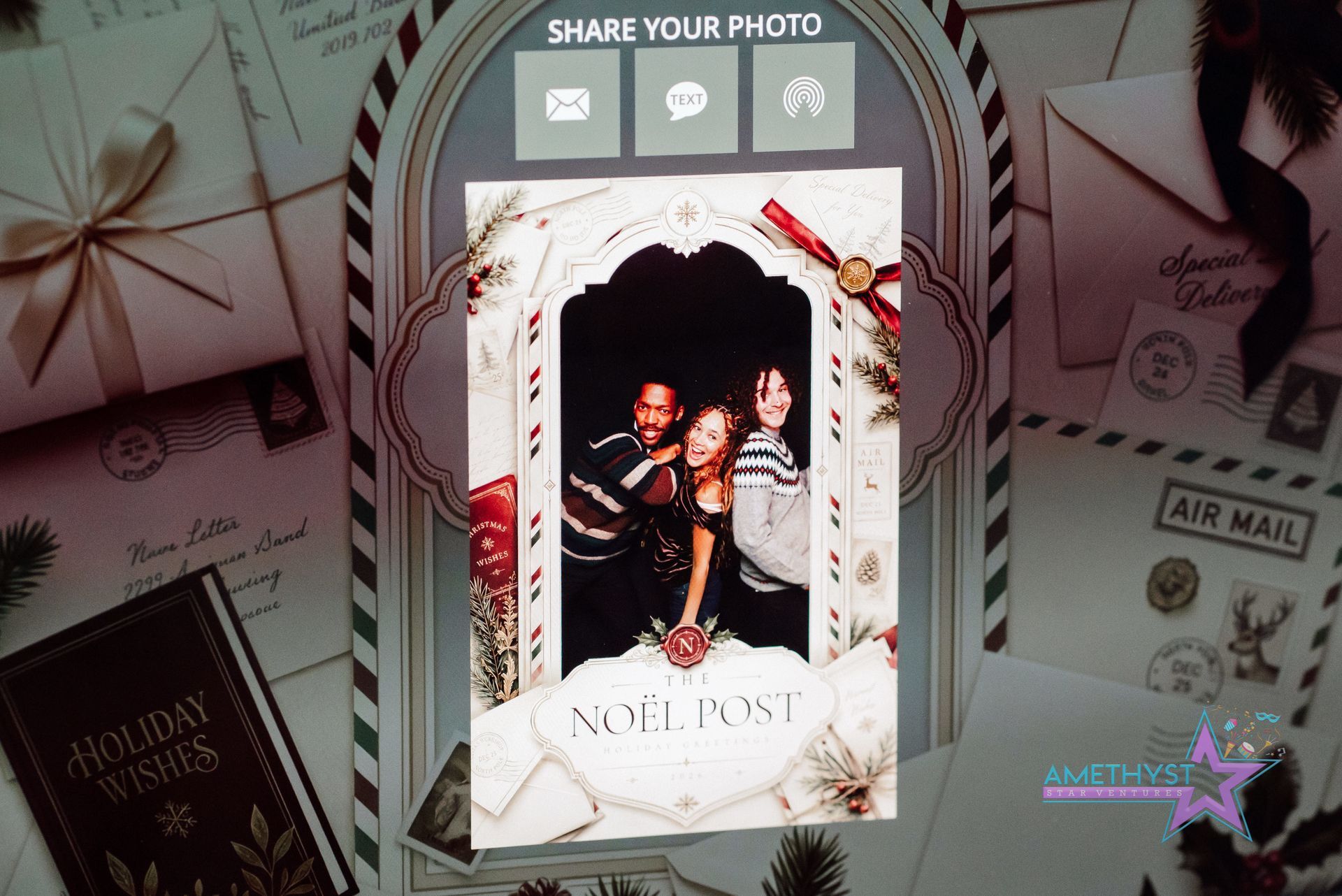 Framed photo booth-style portrait with floral border and “share your photo” header on a decorated table