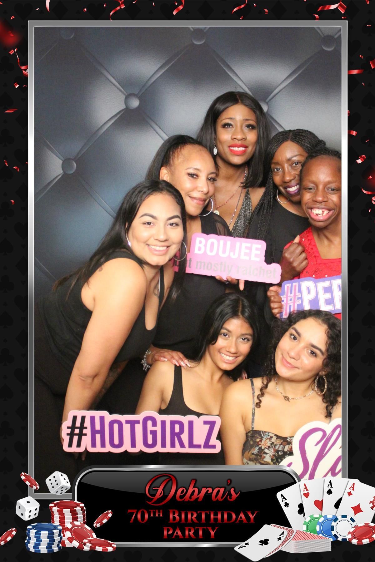 Group of adult guests in a casino themed Mirror Booth layout for Debra’s 70th birthday