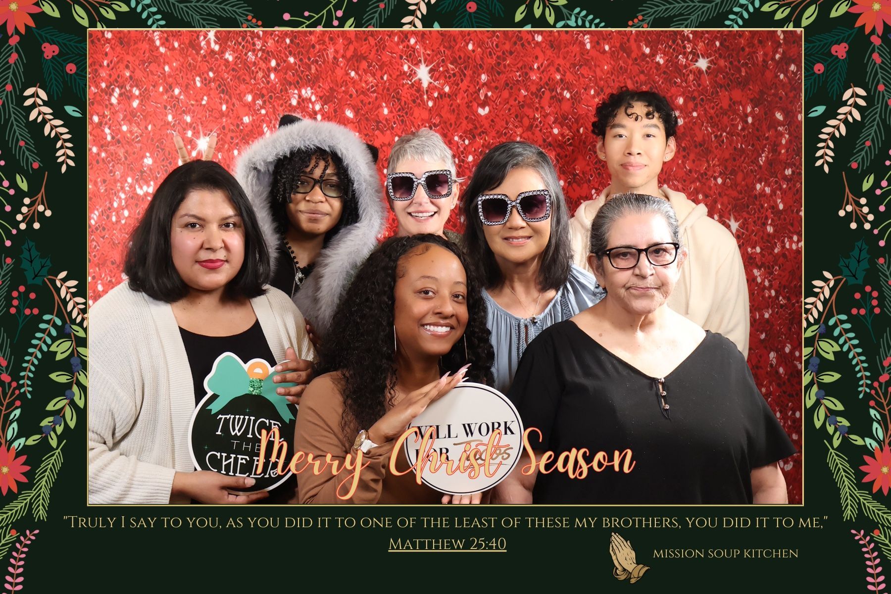 Adult volunteers in a customized Mission Soup Kitchen holiday photo booth layout created in Central Texas