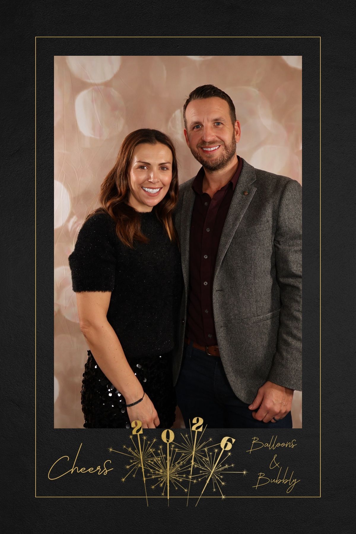 Custom black and gold New Year’s Eve photo booth layout with an adult couple