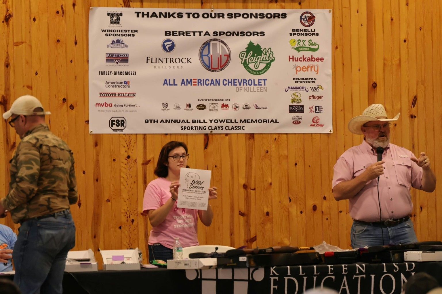 Sponsor banner and guests during the Bill Yowell Memorial Sporting Clays Classic