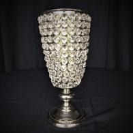 Tall silver goblet covered in clear crystal beads on a black background