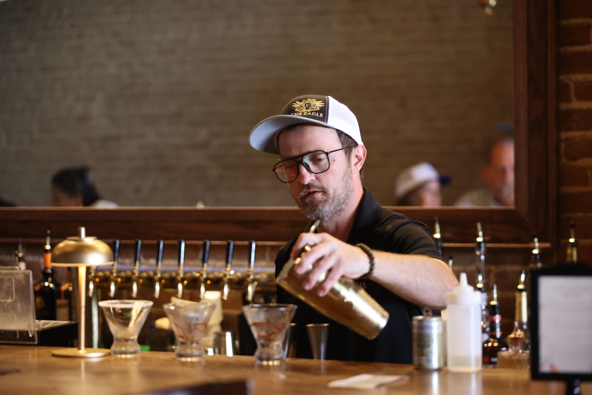 Bartender pouring a drink at The Eagle in Texarkana during Main Street Texarkana's Downtown LIVE