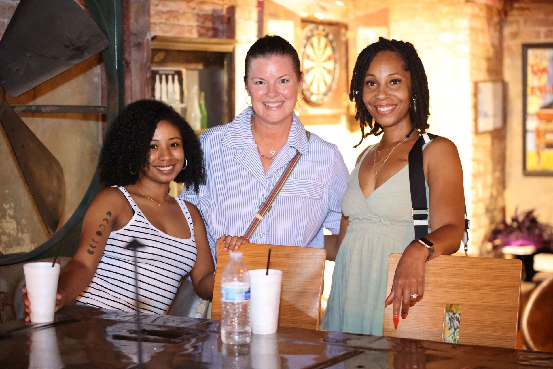 Three people smiling at Verona's Italian during Main Street Texarkana's Progressive Dinner