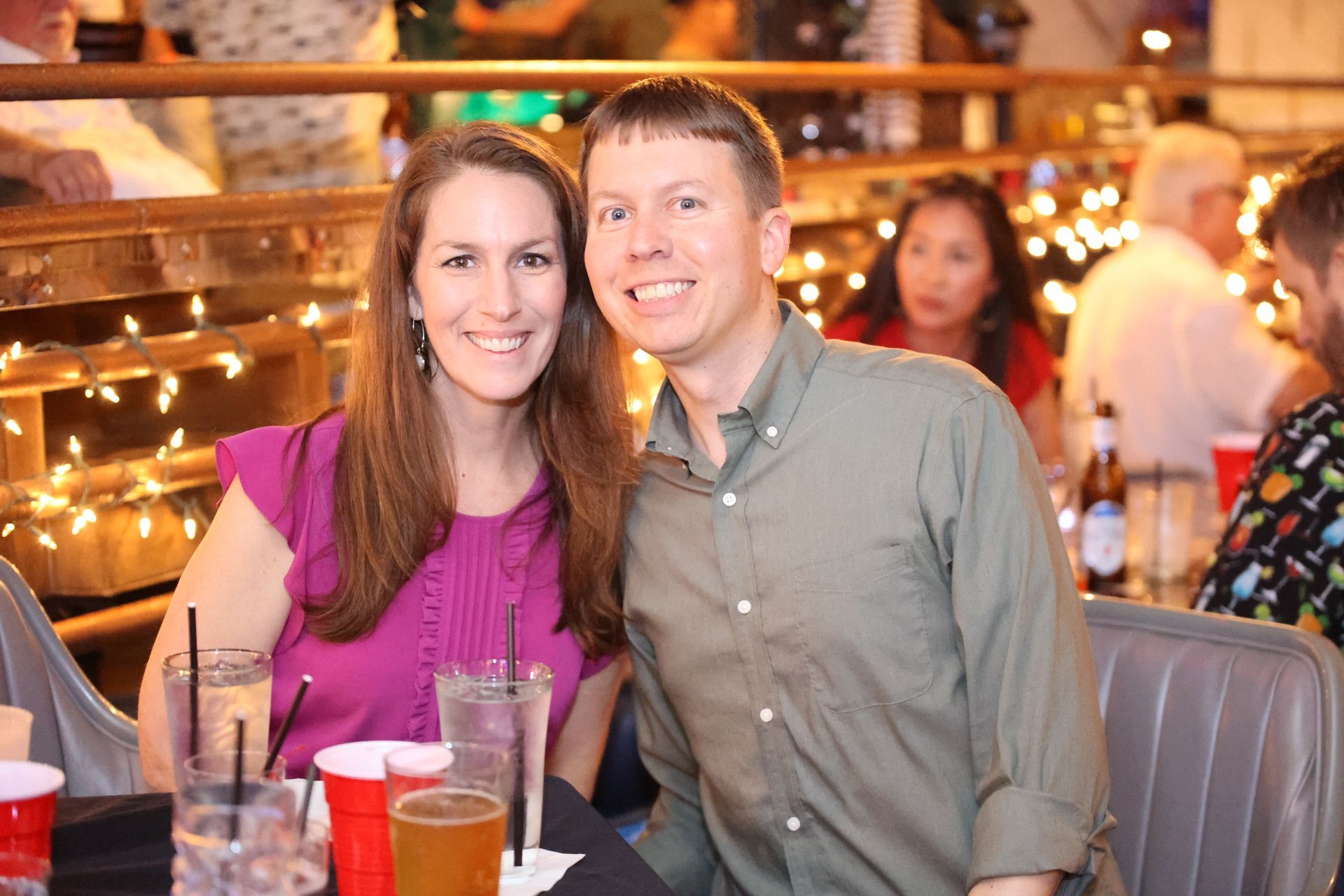 Smiling couple seated at a table in Banana Club during Main Street Texarkana's Progressive Dinner event