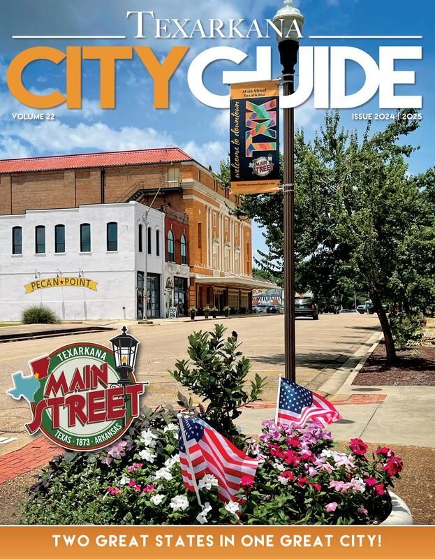 Texarkana City Guide cover: Downtown Main Street with flags, flowers, and buildings; 