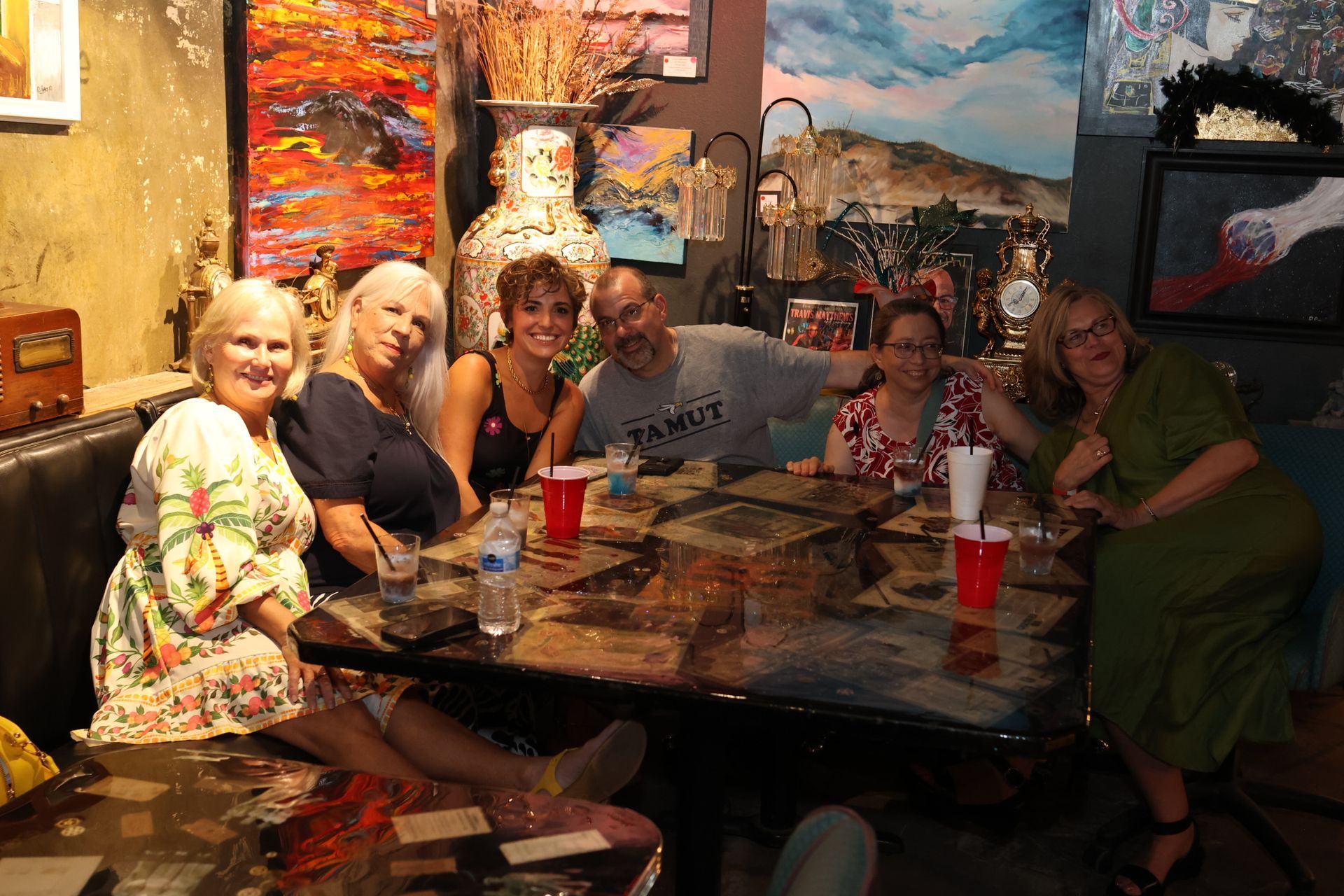 Group of people sitting around a table in Banana Club at Texarkana Main Street's Progressive Dinner event
