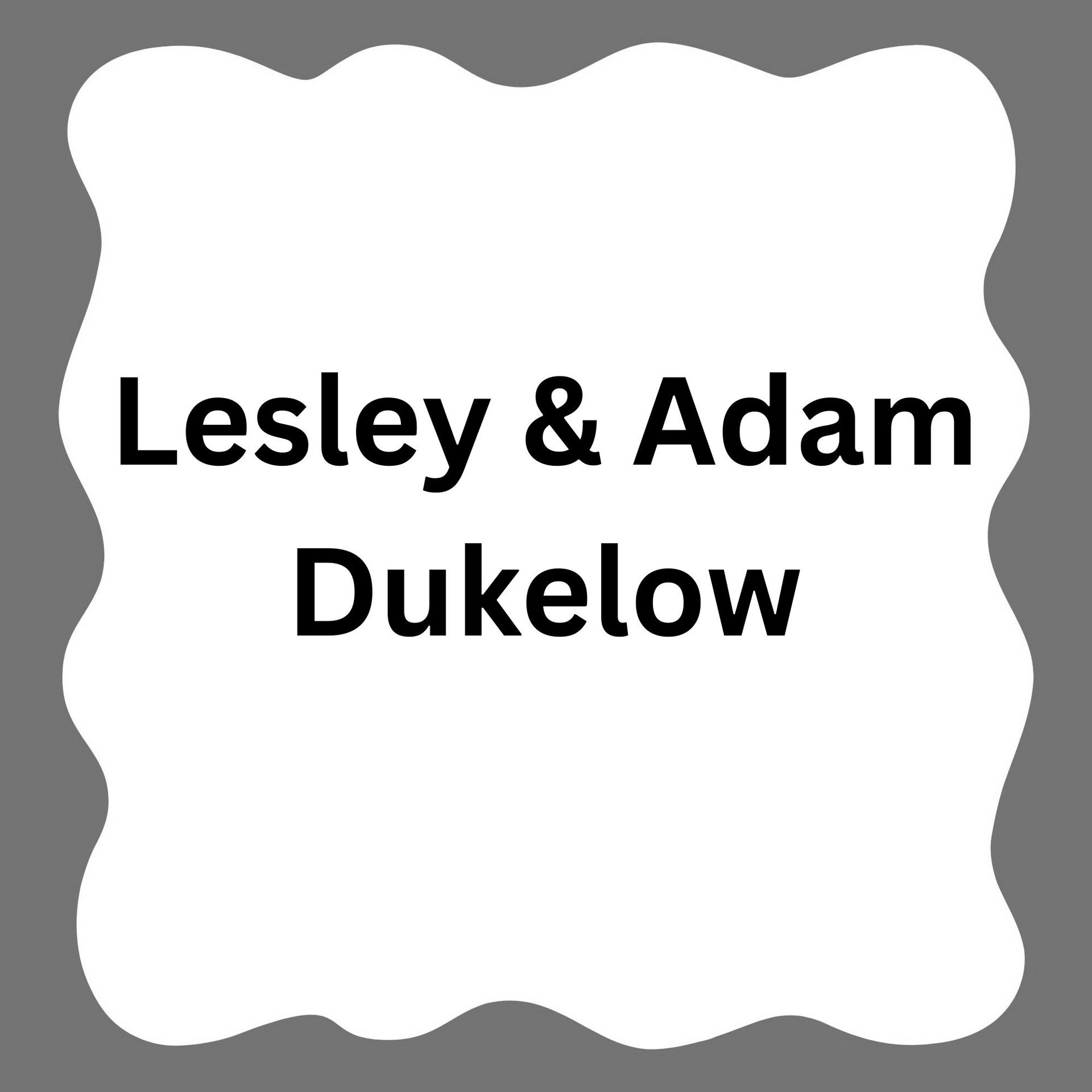 Black text “Lesley & Adam Dukelow” on a white plaque with a blue scalloped border
