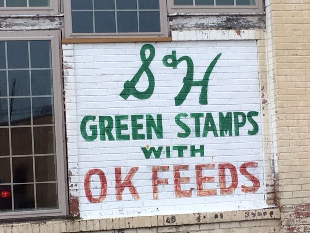 Old brick building sign advertising