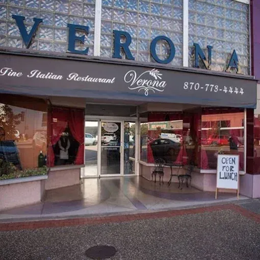 Verona Italian restaurant exterior with gray awning, glass block, and